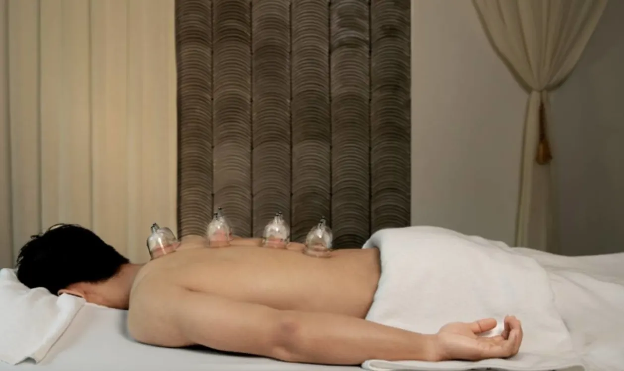 Male guest receiving cupping therapy at TIA Wellness Resort